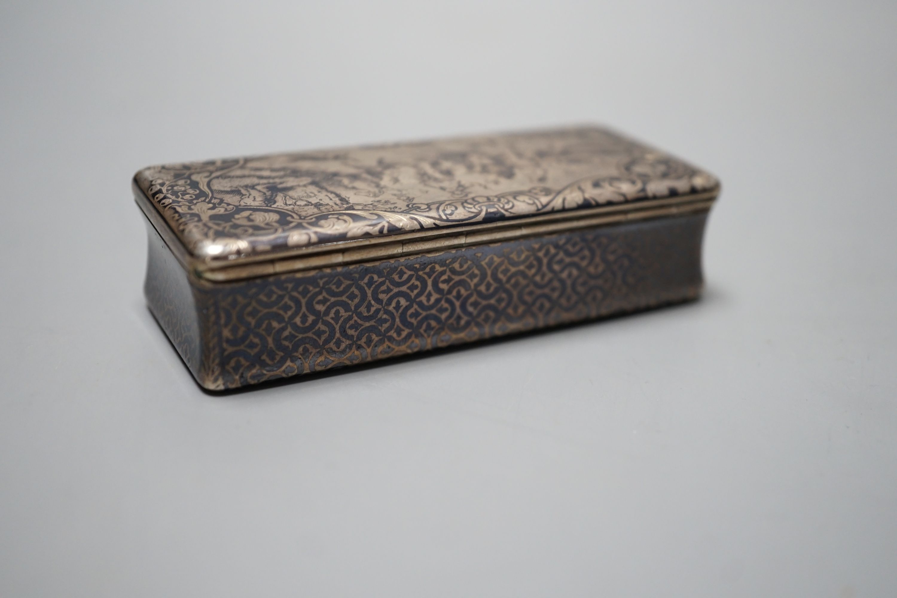 A 19th century French white metal and niello snuff box, decorated with hunting scene, 78mm.